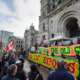 Environmentalists rally with forestry workers at a rally at the provincial legislature organized by the Ancient Forest Alliance (AFA) and the Private and Public Workers of Canada (PPWC) before the 2013 provincial election.