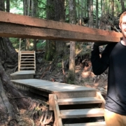 AFA Boardwalk Co-odinator TJ Watt carries materials along the new trail.